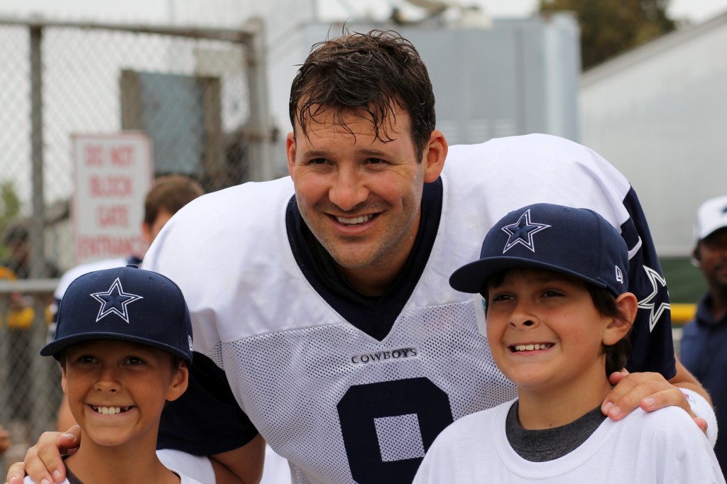 QB Tony Romo with kids